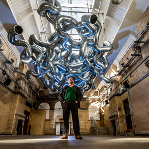 Date: 29th September 2022.Picture James Hardisty.A new installation called Chaos at The Old Parcels Office Artspace in Scarborough by British sculptor Paul Bonomini, who lives and works in London. The gleaming giant steel sculpture hangs in mid air like a threatening cloud. The sound of heavy rain, crashing waves, and ticking clocks bring to mind the encroaching chaos caused by climate change.